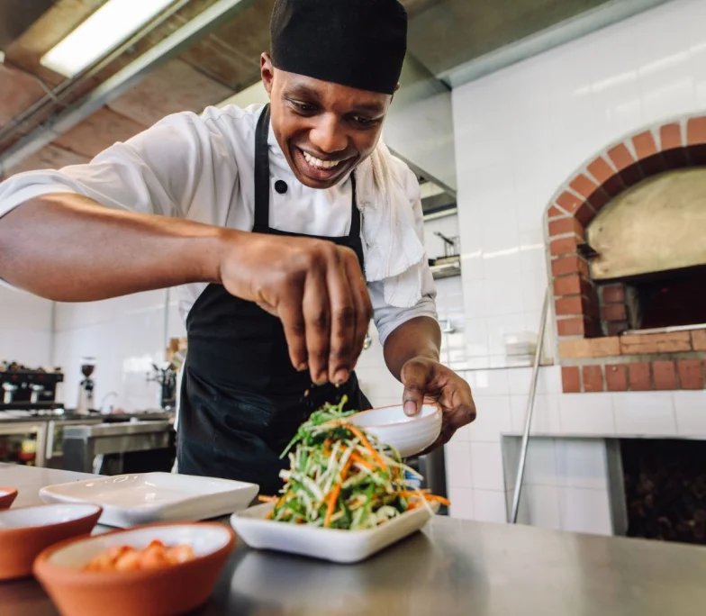 Sweet Savours chef plating a dish